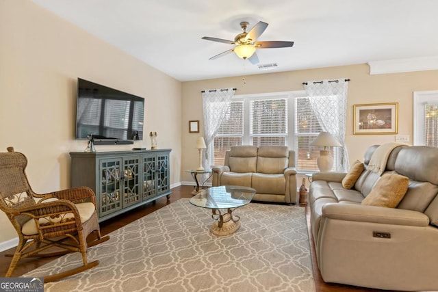 living room with ceiling fan and hardwood / wood-style flooring