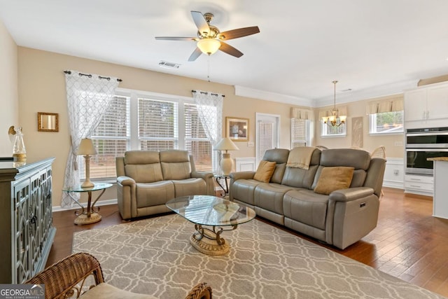 living room featuring crown molding, ceiling fan with notable chandelier, and hardwood / wood-style floors