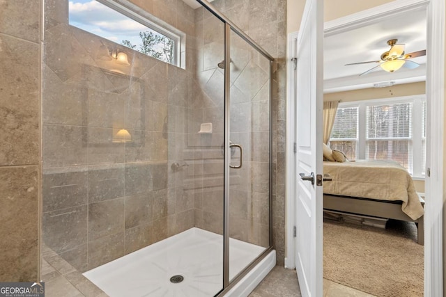 bathroom with walk in shower, a healthy amount of sunlight, and ceiling fan