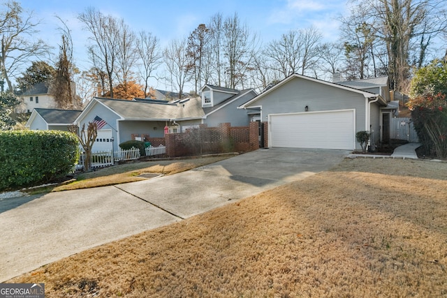 ranch-style house featuring driveway, a fenced front yard, an attached garage, a front lawn, and brick siding