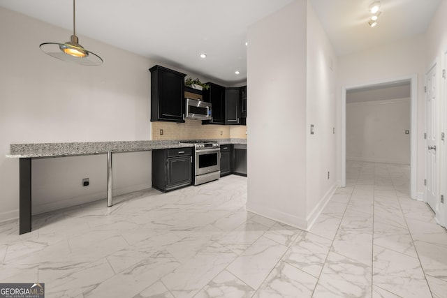 kitchen with decorative light fixtures, light stone counters, tasteful backsplash, and stainless steel appliances