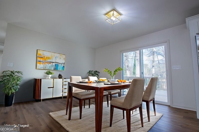 dining room with dark wood-type flooring