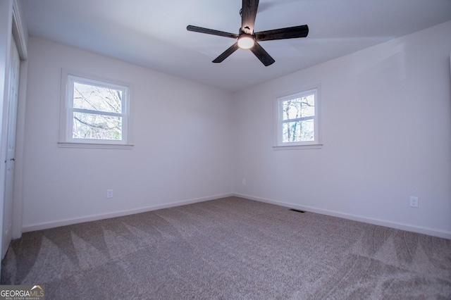 carpeted empty room with ceiling fan