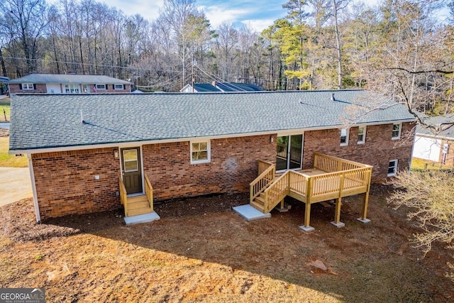 rear view of house with a deck