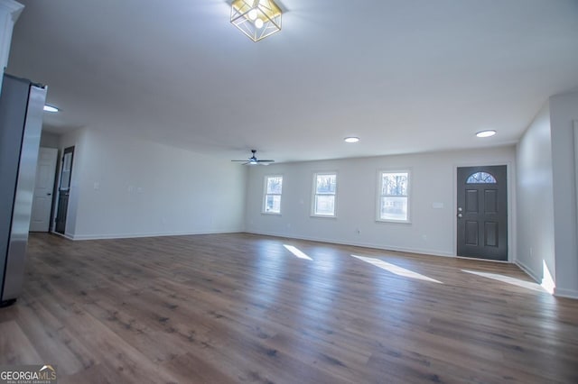 foyer with ceiling fan and dark hardwood / wood-style floors