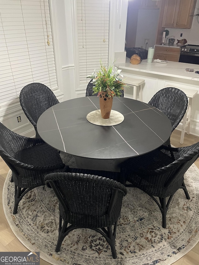 dining area with light wood-type flooring