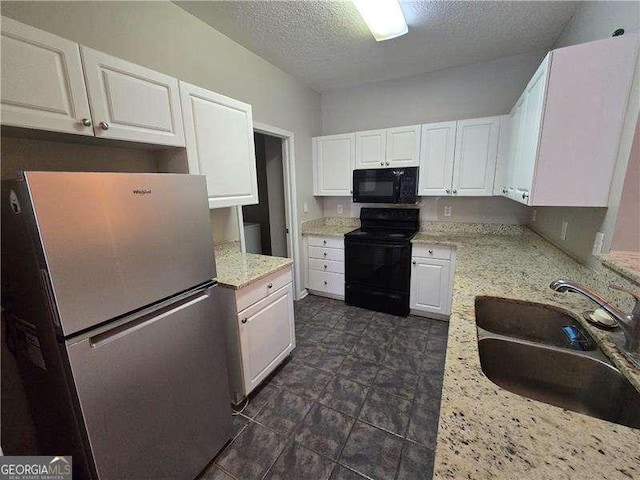 kitchen with a textured ceiling, black appliances, white cabinetry, sink, and light stone counters