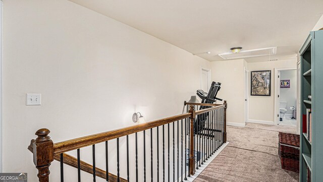 carpeted office featuring vaulted ceiling