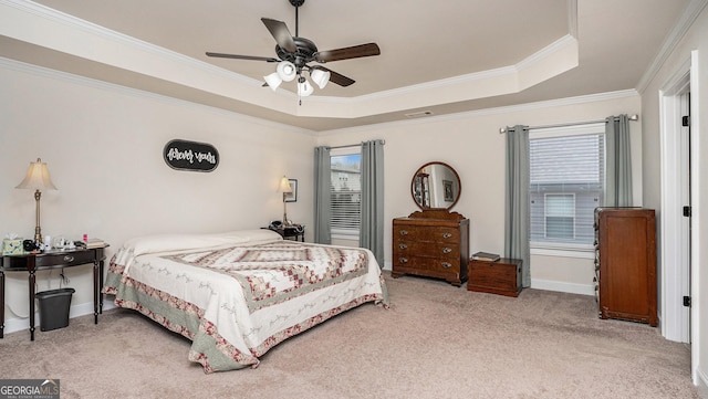 bedroom with ornamental molding, a raised ceiling, light carpet, and visible vents