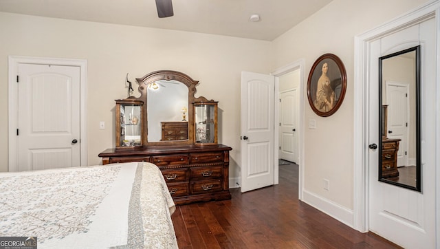 bedroom featuring dark wood-style floors, baseboards, and a ceiling fan