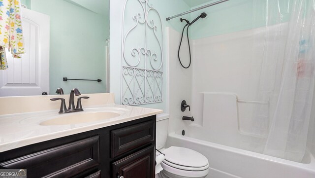 full bathroom featuring shower / bath combination with curtain, vanity, and toilet