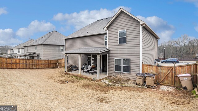 rear view of property with a patio area