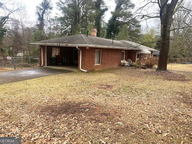 view of property exterior with a carport