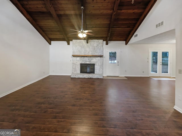 unfurnished living room with a fireplace, wood ceiling, vaulted ceiling with beams, dark wood-type flooring, and ceiling fan