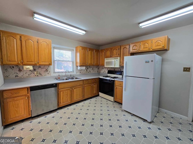 kitchen with sink and white appliances