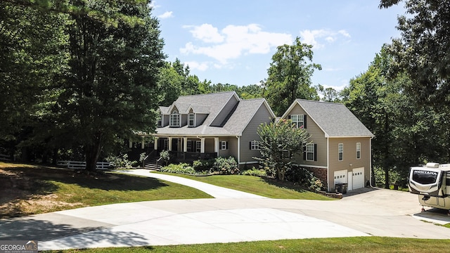 new england style home with a front lawn, a garage, and a porch