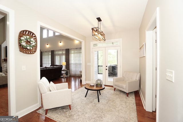 interior space with french doors and hardwood / wood-style floors