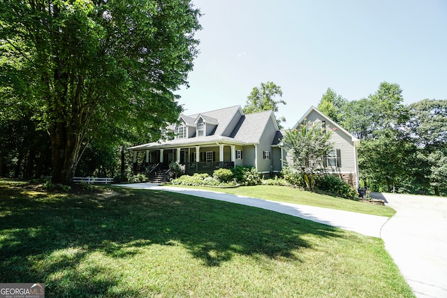 cape cod home featuring a front yard and a porch