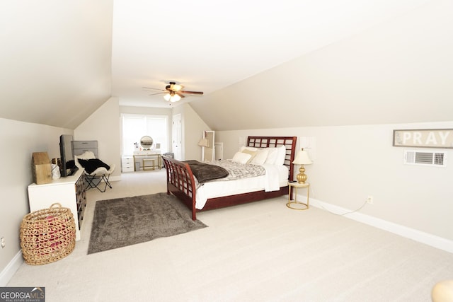 carpeted bedroom with ceiling fan and lofted ceiling