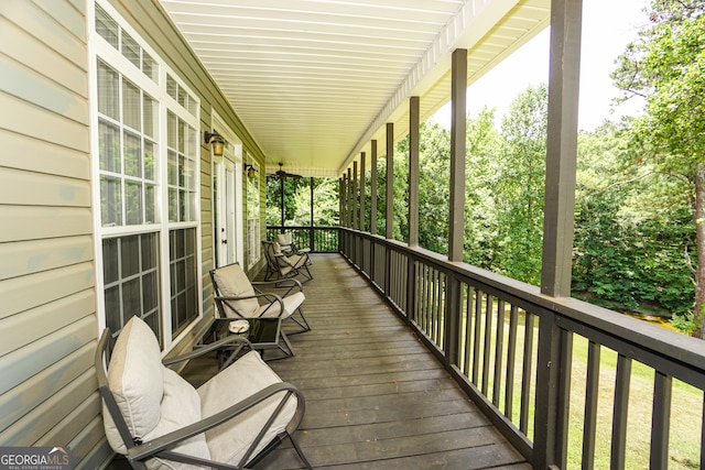 wooden terrace featuring covered porch