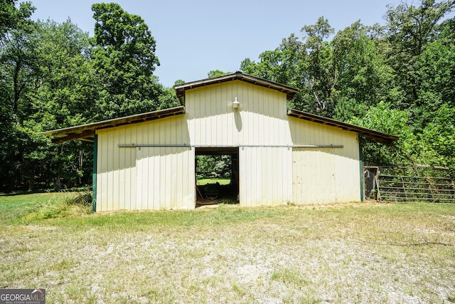 view of outdoor structure with a yard