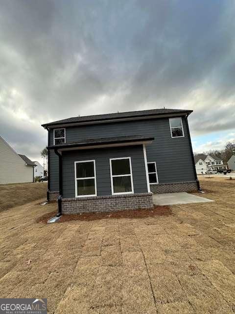 rear view of house with a patio