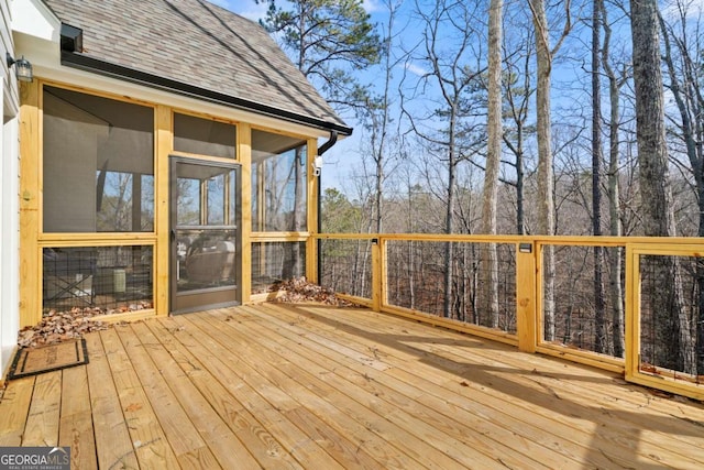 wooden terrace featuring a sunroom