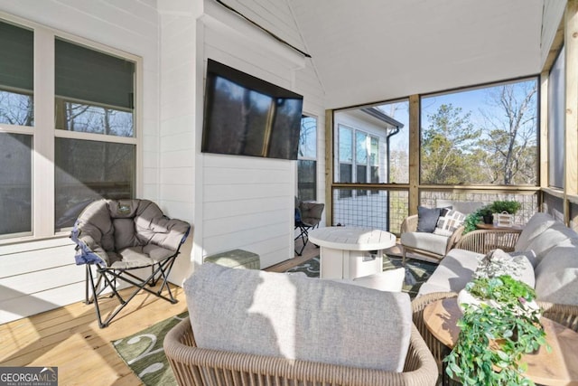 sunroom with vaulted ceiling