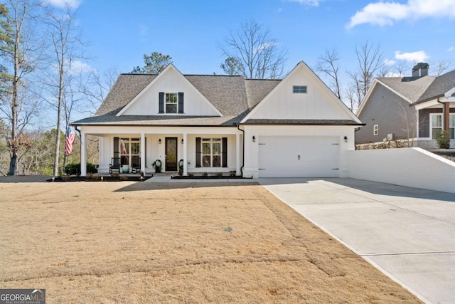 modern farmhouse style home featuring an attached garage, covered porch, a shingled roof, concrete driveway, and board and batten siding