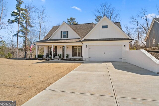 modern farmhouse style home with driveway, roof with shingles, a porch, an attached garage, and board and batten siding