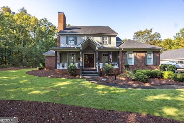 view of front of house featuring covered porch and a front yard