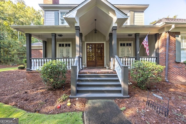 property entrance featuring french doors and a porch