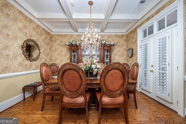 dining room featuring beam ceiling, crown molding, and an inviting chandelier