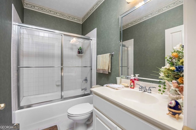 full bathroom with toilet, enclosed tub / shower combo, and vanity