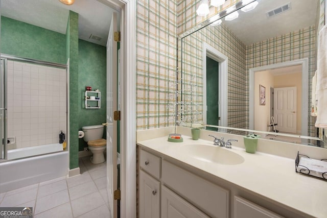 full bathroom featuring tub / shower combination, tile patterned floors, vanity, and toilet