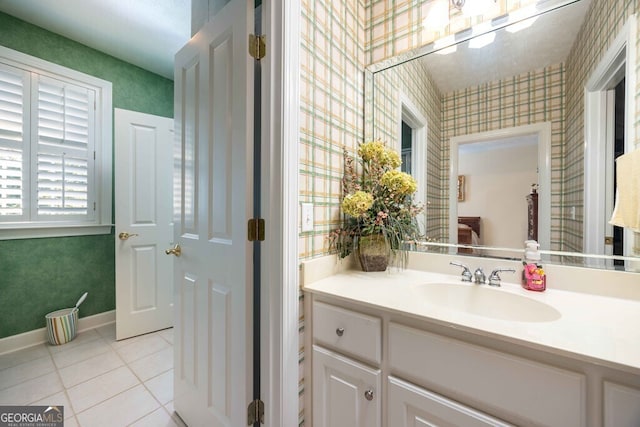 bathroom with tile patterned floors and vanity