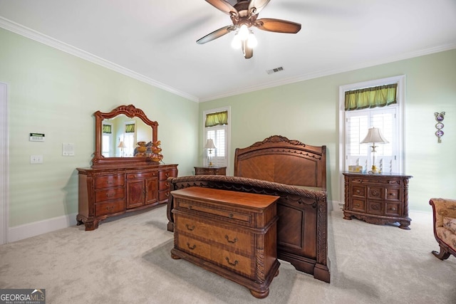 bedroom featuring ceiling fan, ornamental molding, and light carpet