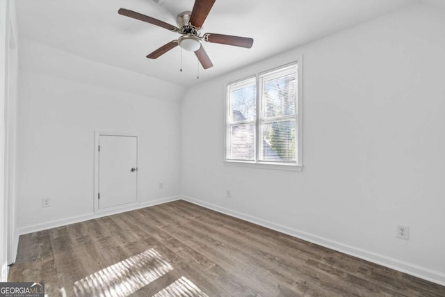 unfurnished room with vaulted ceiling, ceiling fan, and hardwood / wood-style flooring