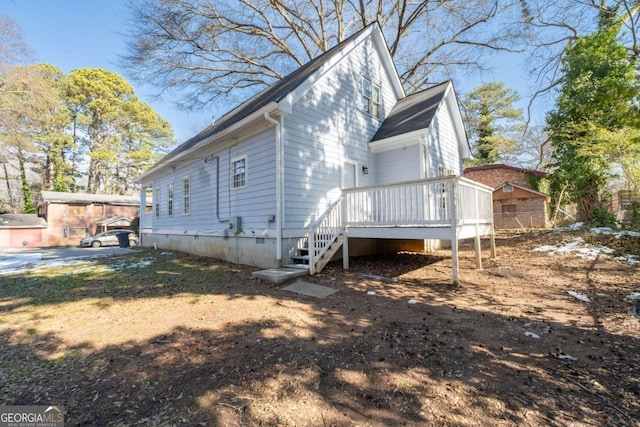 view of property exterior with a wooden deck