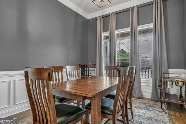 dining area with crown molding and dark hardwood / wood-style floors