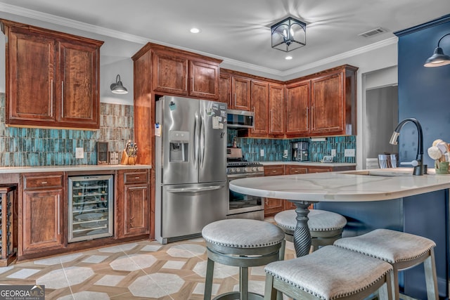 kitchen featuring sink, crown molding, appliances with stainless steel finishes, backsplash, and wine cooler