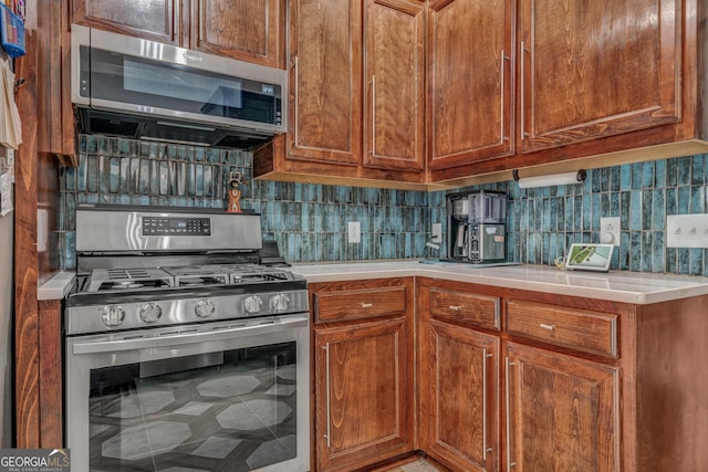 kitchen with backsplash and stainless steel appliances