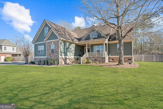 craftsman inspired home featuring a front lawn and covered porch