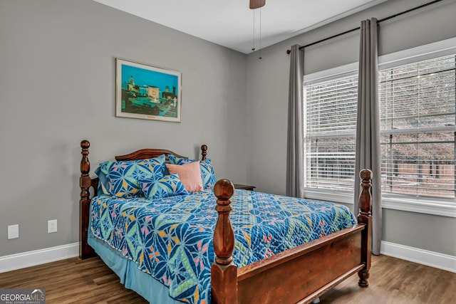 bedroom featuring dark wood-type flooring and ceiling fan