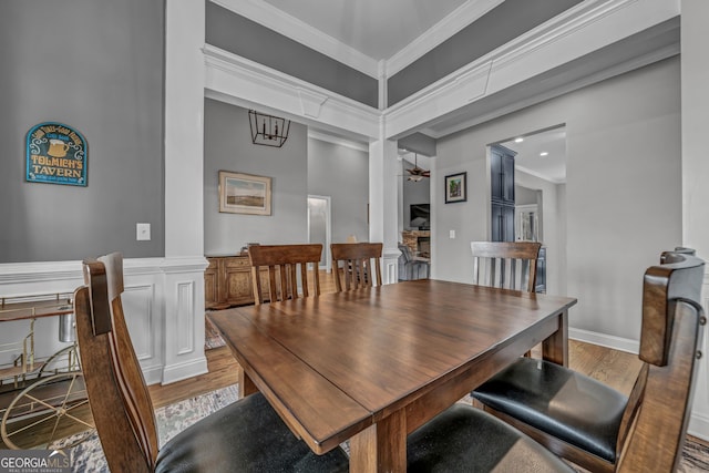 dining space featuring ornamental molding, hardwood / wood-style floors, and ceiling fan