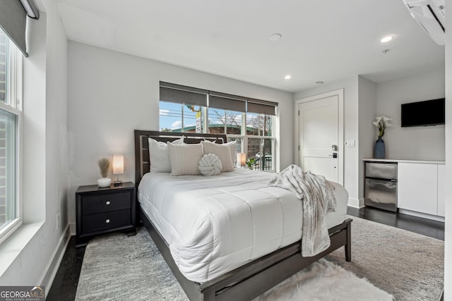 bedroom featuring dark hardwood / wood-style flooring