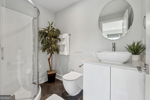 bathroom with vanity, toilet, and an enclosed shower