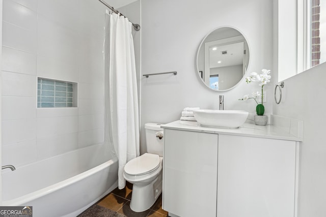 bathroom featuring visible vents, toilet, shower / tub combo, vanity, and tile patterned flooring