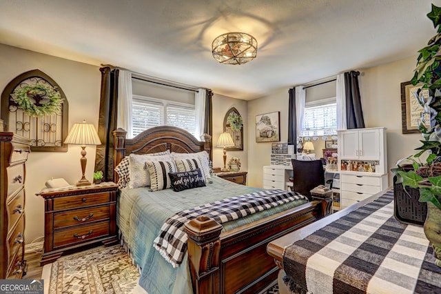 bedroom with wood-type flooring