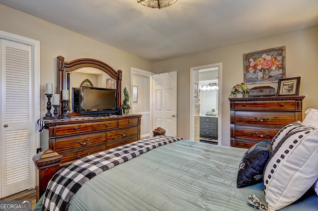 bedroom with a closet and connected bathroom